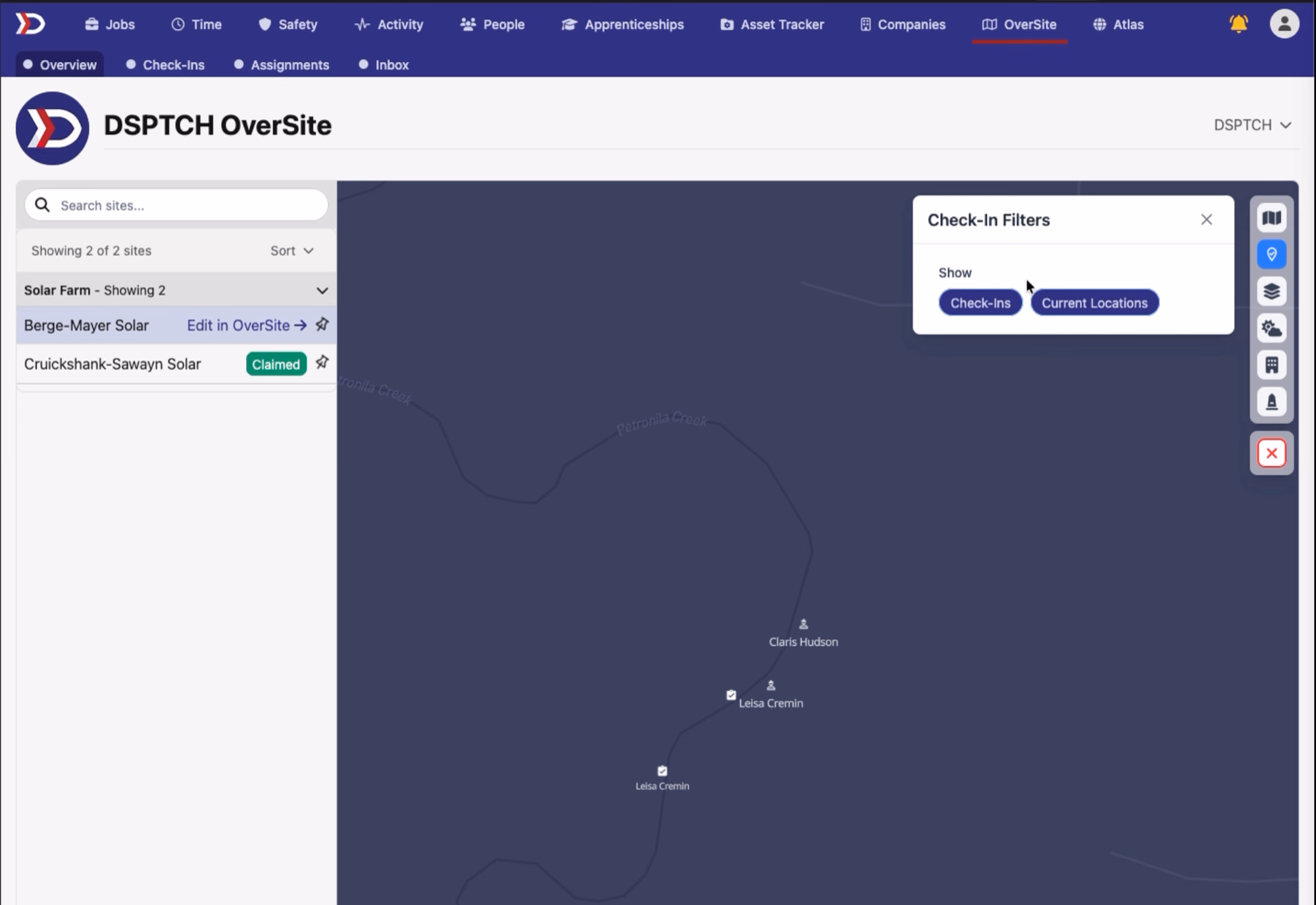 OverSite Overview map with the Check-In Filters panel open showing Check-Ins and Current Locations toggle buttons; two clipboard check-in pins for Leisa Cremin and a person marker for Claris Hudson are visible on the map, with the Sites sidebar listing Berge-Mayer Solar and Cruickshank-Sawayn Solar