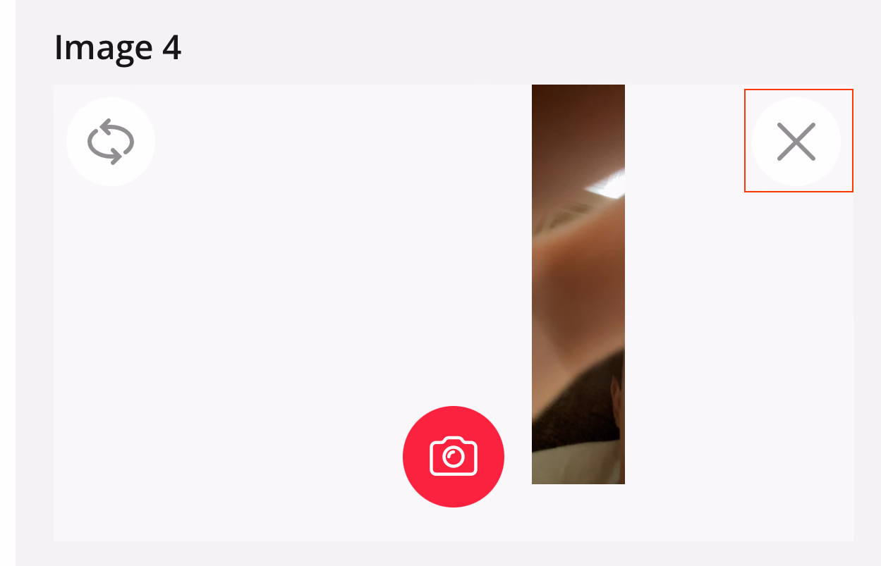 Photo capture view with X delete button highlighted in top right corner