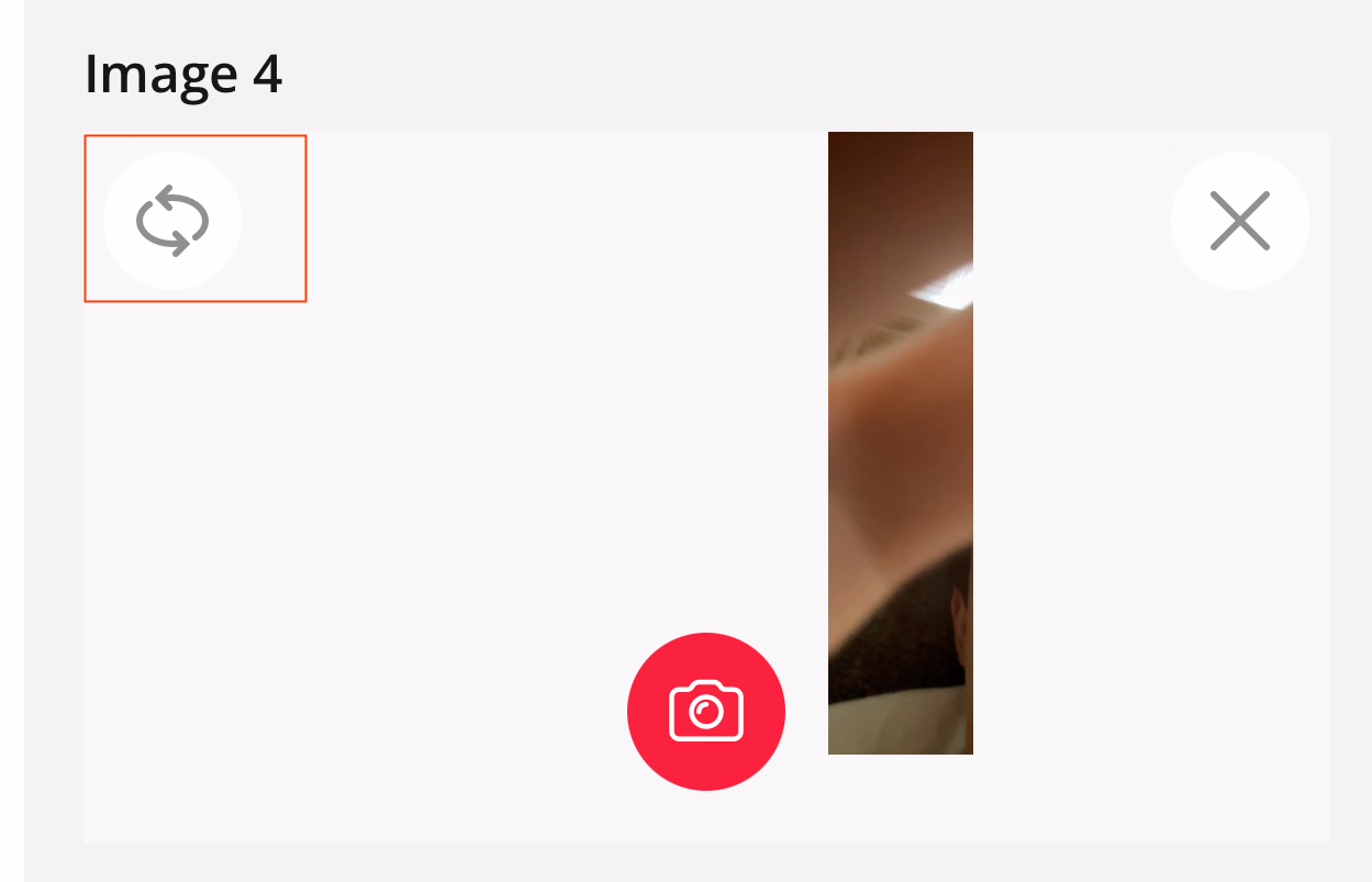 Photo capture view with rotate switch camera button highlighted in top left
