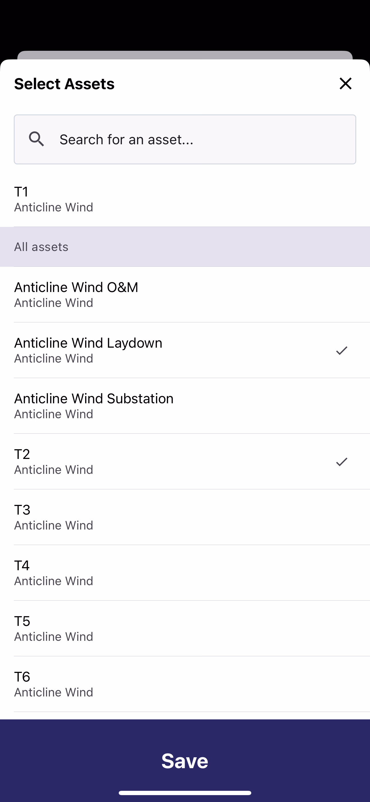 Select Assets modal with search bar and list of wind farm assets with checkmarks